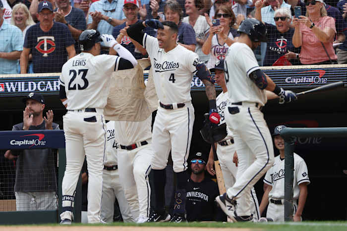 Oct 3, 2023; Minneapolis, Minnesota, USA; Minnesota Twins short stop Royce Lewis (23) celebrates with shortstop Carlos Correa after hitting a home run in the third inning against the Toronto Blue Jays during game one of the Wildcard series for the 2023 MLB playoffs at Target Field.